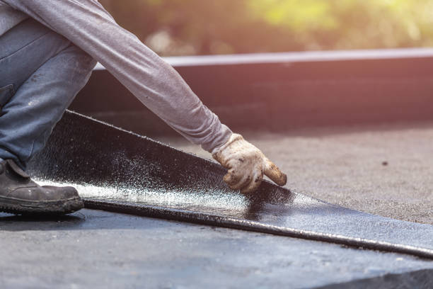 Professional Basement Waterproofing technician working in Hingham, WI